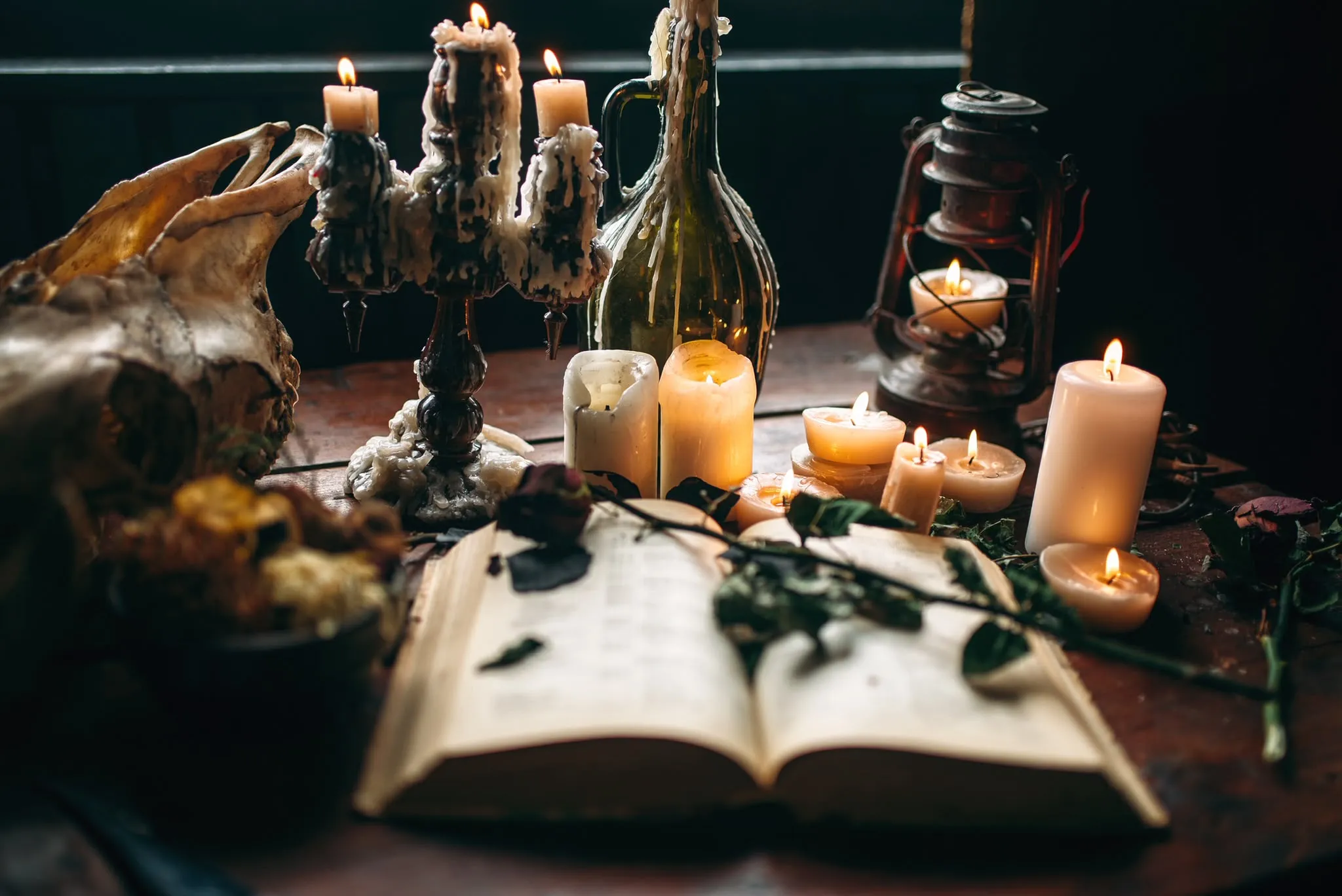 Candles, an open spell book and roses on Cate McMurray's altar Walsall