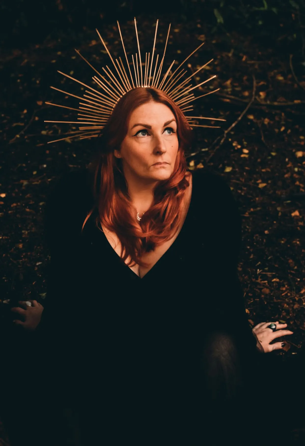 Cate McMurray in a golden halo crown for The Goddess Code coaching