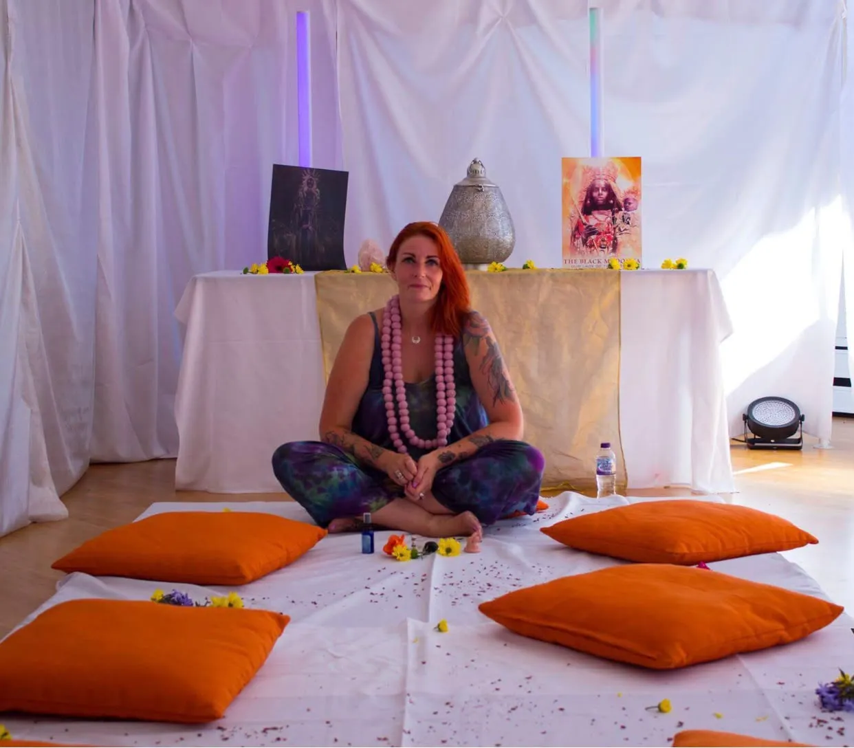 Cate McMurray seated in a women's sacred tarot circle space Walsall