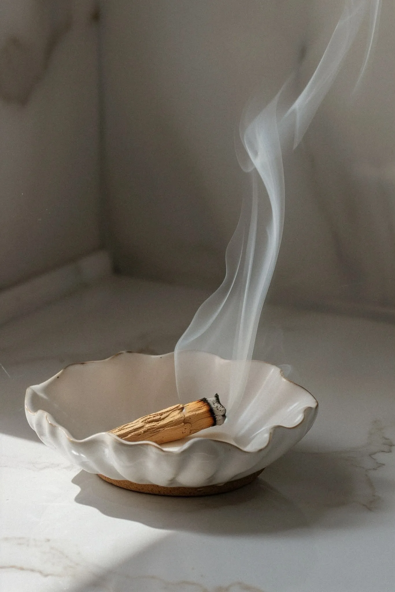 Smoke cleansing bowl on a marble surface